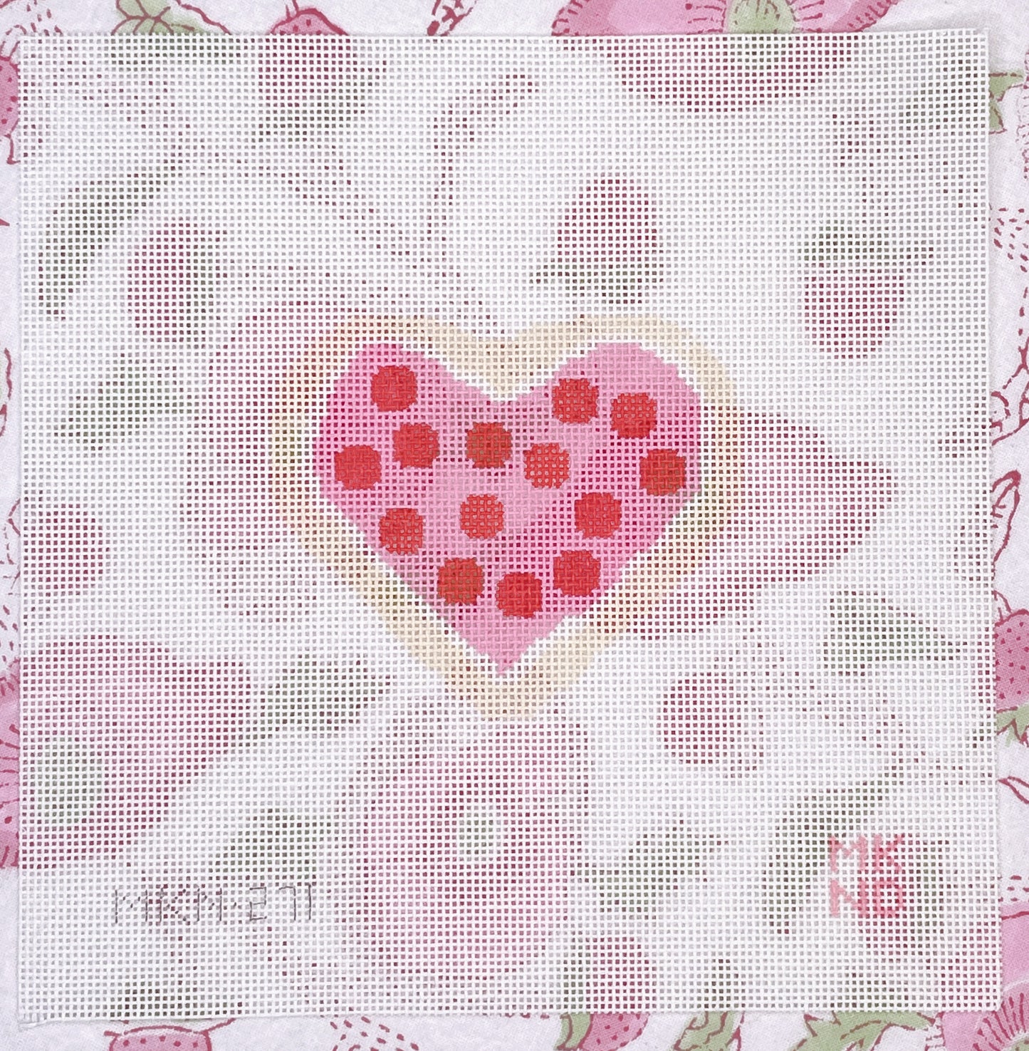 pink cookie w/ red dots